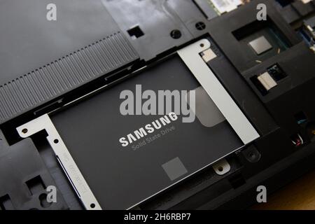 2021. Spain. Close-up of a Samsung brand solid state drive (SSD) installed in an old laptop that is being upgraded Stock Photo