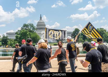 A group of Proud Boys and Trump supporters march to the US Capitol building in Washington DC on 4th July, 2020. Credit: Rise Images/Alamy Stock Photo