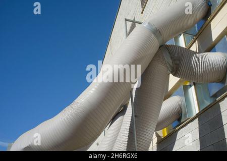Temporary air conditioning machinery outdoors. Huge tubes are inserted from outside Stock Photo