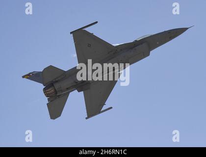 United States Air Force F-16 Viper take off with some vapor on the upper fuselage Stock Photo