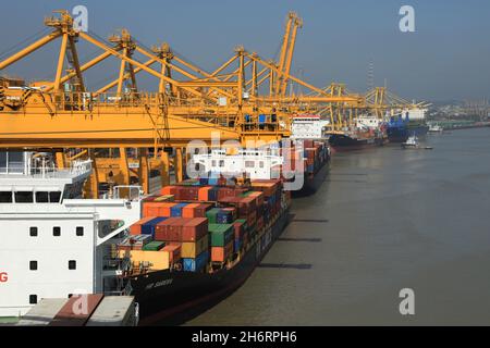 Chittagong, Bangladesh. 17th Nov, 2021. Aerial view of containers and shipyard cranes at Chittagong Port. Chittagong Port and Kurnofuly river play an important economy role in Bangladesh. Credit: SOPA Images Limited/Alamy Live News Stock Photo