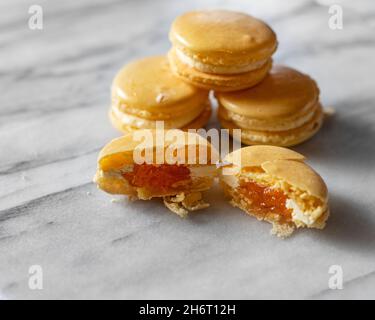 Mango Macarons on White Marble Stock Photo