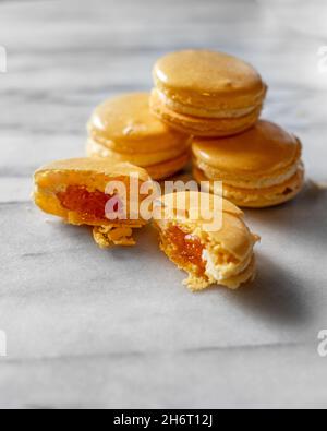 Mango Macarons on White Marble Stock Photo