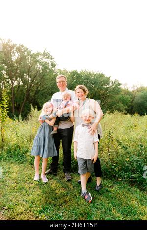 Outdoors portrait of a family of five Stock Photo