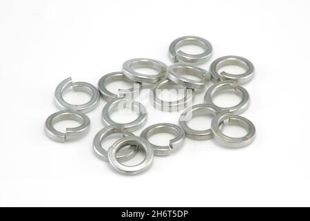 Heap of 8mm split spring washers on white background Stock Photo