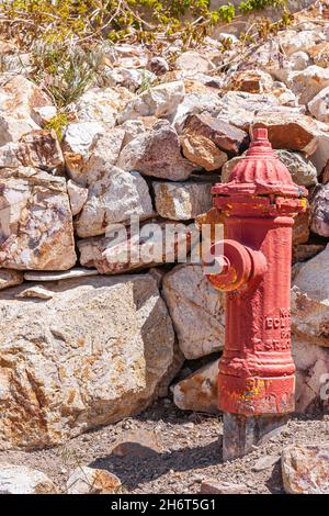 Tonopah, Nevada, US - May 16, 2011: Historic Mining Park. Closeup of red vintage water hydrant near entrance of mine. Stock Photo