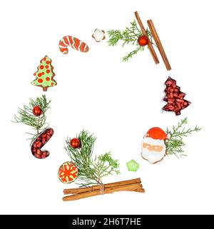 Christmas wreath with gingerbread cookies and decorations isolated on white background Stock Photo