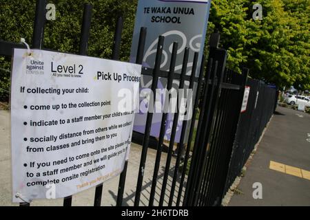 A sign listing the rules parents need to follow when picking up children up from Te Waka Unua School. A person who travelled to Auckland for a Tangi (Maori funeral) had tested positive for covid-19 after they became symptomatic on their return to Christchurch on Sunday. The person lives in a household of six in the southeast of Christchurch, three of their children are now in a MIQ (managed isolation quarantine). Another person has tested positive in Christchurch today. Testing stations at two locations in Christchurch were busy with people wanting to be tested. (Photo by Adam Bradley/SOPA I Stock Photo