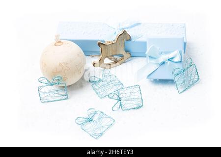 Christmas and newborn motifs on white snowy background Stock Photo