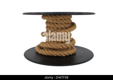 Braided natural jute rope wrapped on the reel isolated on white background Stock Photo