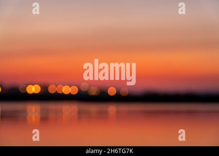 Blurry Beautiful Sunset in Croatia. Sunlight on the shore of Sea. Beautiful colors. Reflection Stock Photo