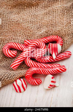 small candy canes and red and white sweets with copy space Stock Photo