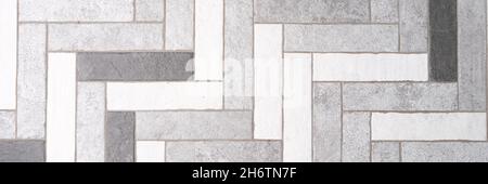 Mosaic floor tiles in rectangles in shades of gray and white closeup Stock Photo