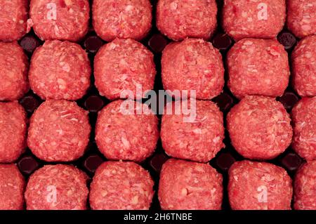 Fresh raw ground beef meat meatball pack background Stock Photo
