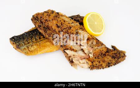 Two cooked smoked peppered mackerel fish fillets Stock Photo