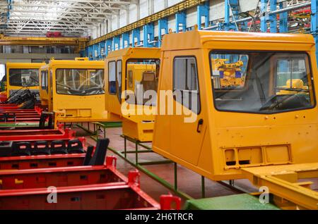 Production process of heavy mining trucks at the factory. Dump truck on ...