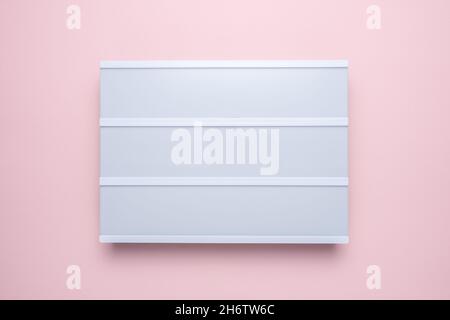 Blank lightbox on pastel pink background. Mockup concept. Stock Photo