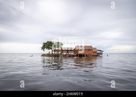 Traditional house on an artificial island in Lau Lagoon, Malaita Province, Solomon Islands. Stock Photo