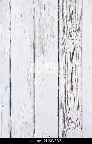 Weathered distressed wood plank background with old white paint. Stock Photo