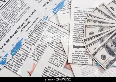 top view of dollar banknotes on newspapers Stock Photo