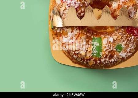 Spanish typical epiphany cake 'Roscon de Reyes' on green background Stock Photo