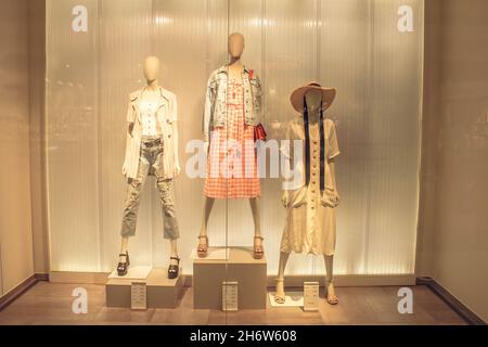 POLAND, TORUN - March 1, 2020: Three female mannequins in store window show spring summer clothing collection. White stylish dummies Stock Photo