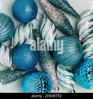 Blue glittering Christmas toys. Festive texture concept. Stock Photo