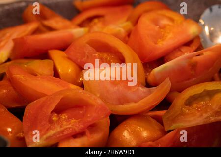 Salad buffet in the restaurant. Bowl with pieces of tomatoes.  Stock Photo