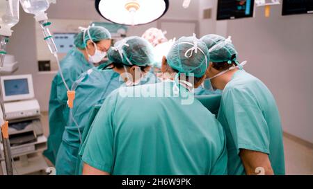 Close-up of doctors working as a team during an operation in an operating room Stock Photo