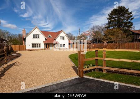 Clavering, England -  April 6 2020: Brand new modern home constructed in a traditional style nearing completion and unoccupied with landscaped garden Stock Photo