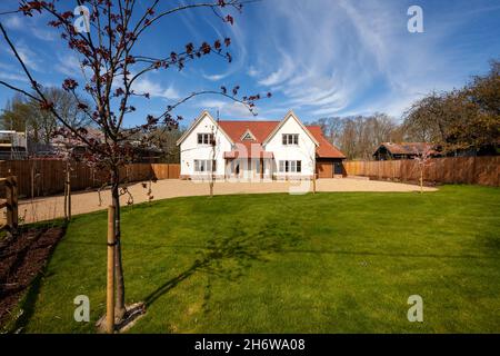 Clavering, England -  April 6 2020: Brand new modern home constructed in a traditional style nearing completion and unoccupied with landscaped garden Stock Photo