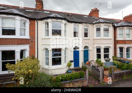 Cambridge, England - August 15 2019 Bay fronted victorian terraced house in street of similar traditional British homes taken from public highway Stock Photo