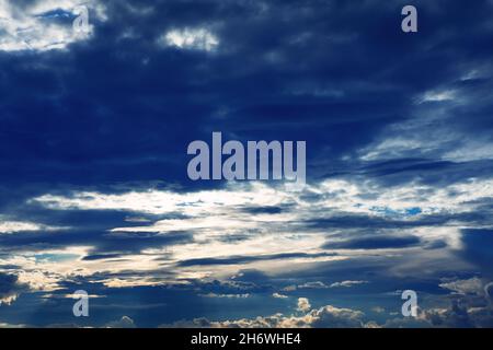 Blue clouds with sunbeams . Stormy weather heaven Stock Photo