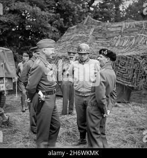 NEAR CAEN, FRANCE - 07 July 1944 - British General Bernard Montgomery with US Generals George S Patton (left) and Omar N Bradley (centre) at 21st Army Stock Photo