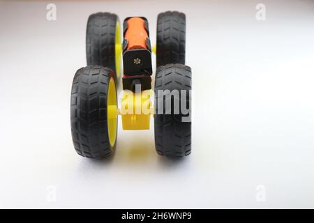 Working model small scale electric car made by Dual shaft dc motor and big wheels, Stem projects for creative engineer Stock Photo