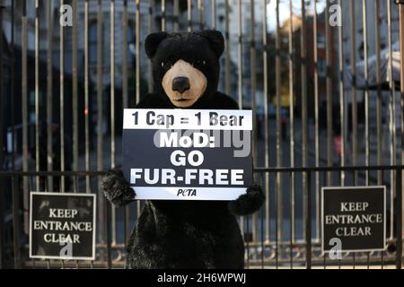 An activist dressed as a bear holds a placard expressing his opinion during the People for the Ethical Treatment of Animals (PETA) ‘Bear’ to Boris Johnson: ‘Save My Skin! demonstration in London. (Photo by Pietro Recchia / SOPA Images/Sipa USA) Stock Photo