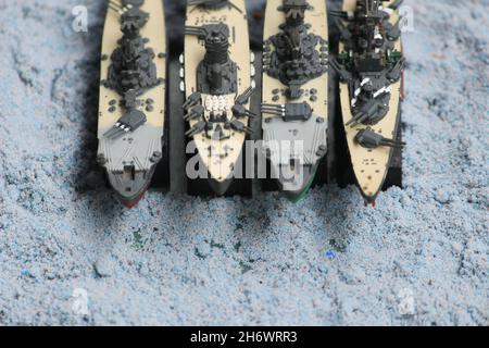 The lineup of miniature battleships consists of the enterprise carrier, the submarine, the battleship Musashi, the battleship Yamato Stock Photo