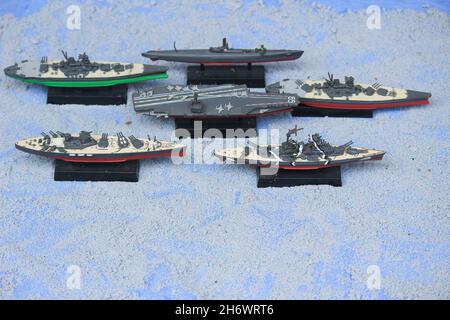 The lineup of miniature battleships consists of the enterprise carrier, the submarine, the battleship Musashi, the battleship Yamato Stock Photo