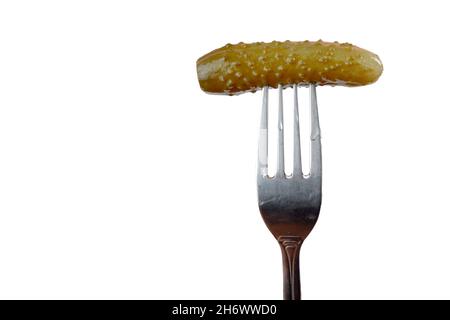 pickled cucumber on a fork isolated on a white background Stock Photo