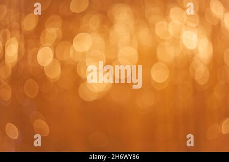 Bokeh lights background. Abstract golden colored light. Christmas concept. Stock Photo