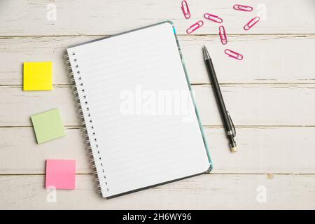 Keyboard Over A Table Beside A Notebook And Pens With Sticky Notes Stock Photo