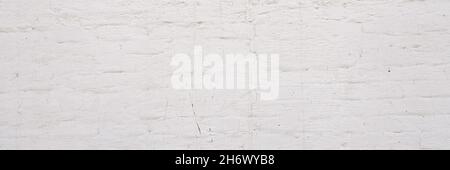 White brick wall background. Simple grungy white brick wall as seamless pattern texture background. Stock Photo