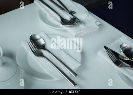 cutlery and empty plate on white background  Stock Photo