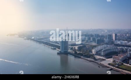 Aerial view of Lisbon and Vasco da Gama Tower, early morning with a haze of fog. Lisbon Portugal 10 November 2021 Stock Photo