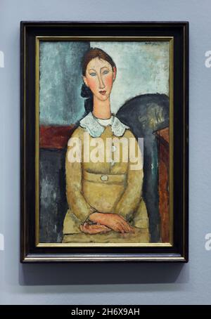Painting 'Girl in a Yellow Dress' by Italian modernist painter Amedeo Modigliani (1917) on display at his retrospective exhibition in the Albertina Museum in Vienna, Austria. The exhibition marking the centenary of artist's death runs till 9 January 2022. Stock Photo