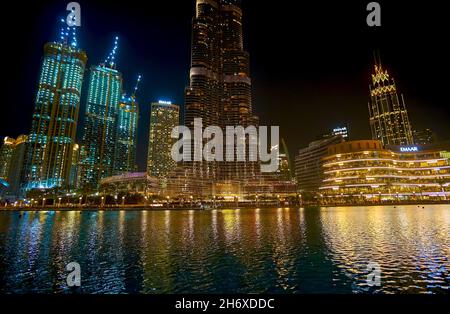DUBAI, UAE - MARCH 3, 2020: The bright illuminated Burj Khalifa and suttoundings highrises of Downtown district at night, on March 3 in Dubai Stock Photo