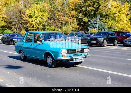 Bucharest, Romania, 24 October 2021: Old vivid blue Romanian Dacia 1300 classic car in traffic in the city center, in a sunny autumn day Stock Photo