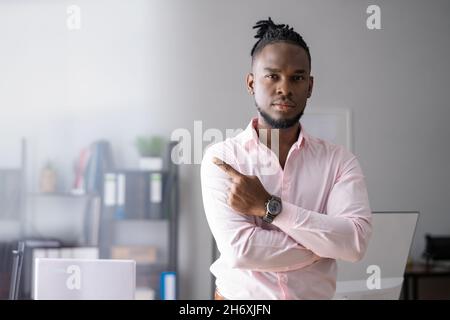 African American Man Pointing Hand Sign In Office Stock Photo