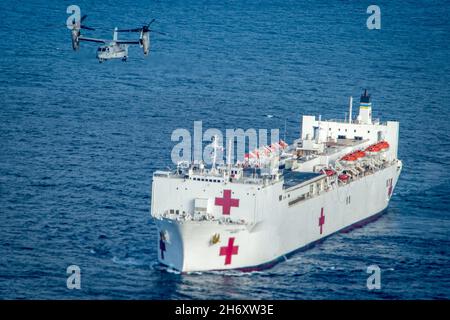 Pacific Ocean. 10th Nov, 2021. An MV-22B Osprey assigned to Marine Medium Tiltrotor Squadron (VMM) 164, based at Marine Corps Air Station (MCAS) Camp Pendleton, Calif., conducts flight operations aboard the Military Sealift Command (MSC) hospital ship USNS Mercy (T-AH 19) during Mercy Exercise (MERCEX) 22-1, Nov. 10, 2021. MERCEX 22-1 is a three-week-long pierside and underway training evolution that highlights integration, training and camaraderie between MSC civilian mariners and MTF Sailors. USNS Mercy (T-AH 19) can steam to assist anywhere to provide relief as a symbol of Navy Medicin Stock Photo