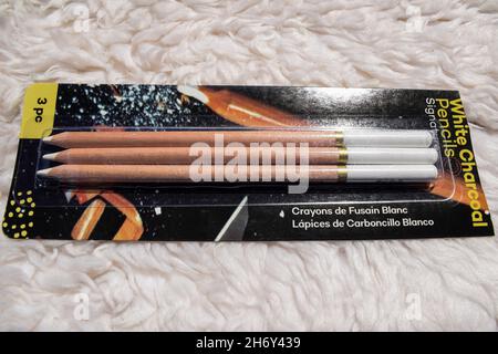White charcoal pencil used in art sketching and colouring. art tools objects. wooden pencil with white colored charcoal pencil Stock Photo
